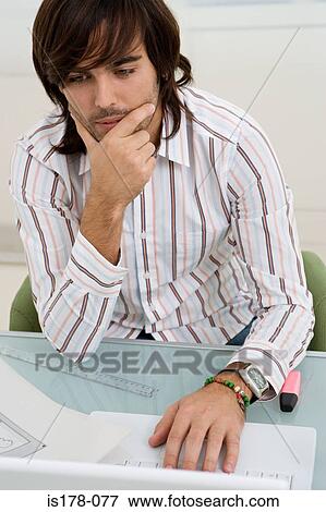 Young man thinking View Large Photo Image Stock Photo - Young man thinking. Fotosearch