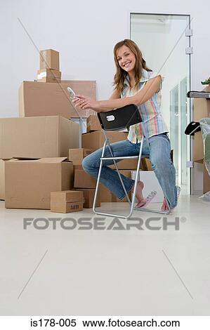 Young woman in a new office View Large Photo Image Stock Photography - Young woman in a new office. Fotosearch