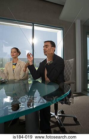Business people meditating View Large Photo Image Stock Photo - Business people meditating. Fotosearch