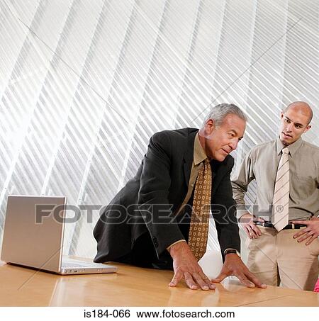 Businessman in discussion View Large Photo Image Stock Photograph - Businessman in discussion. Fotosearch