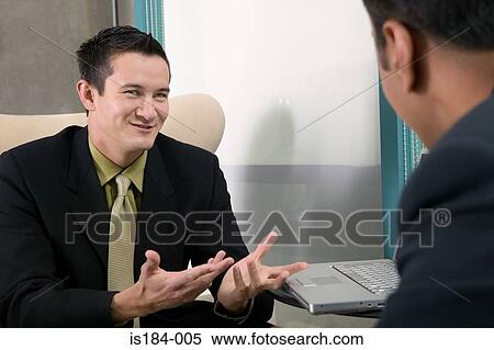 Businessmen having a discussion View Large Photo Image Stock Photography - Businessmen having a discussion. Fotosearch