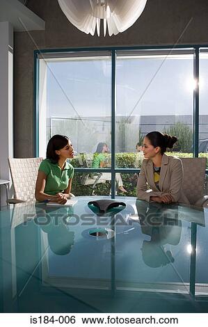 Businesswoman and PA in meeting room View Large Photo Image Stock Photograph - Businesswoman and PA in meeting room. Fotosearch