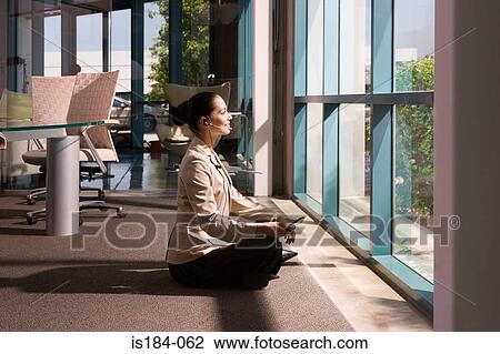 Businesswoman sitting on the floor View Large Photo Image Stock Image - Businesswoman sitting on the floor. Fotosearch