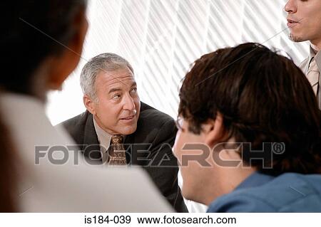 Stock Photo - Men in a meeting. Fotosearch