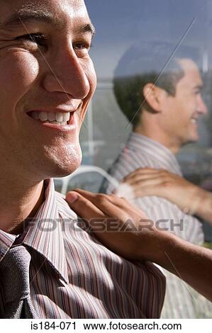 Stock Image - Office worker being congratulated. Fotosearch