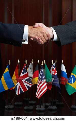 Businessmen shaking hands View Large Photo Image Picture - Businessmen shaking hands. Fotosearch