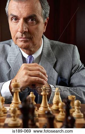 Ceo playing a game of chess View Large Photo Image Stock Photo - Ceo playing a game of chess. Fotosearch