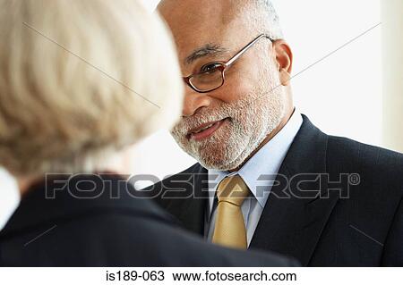 Portrait of two mature office workers View Large Photo Image Stock Image - Portrait of two mature office workers. Fotosearch