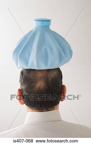 Man with ice pack on his head View Large Photo Image Stock Photo - Man with ice pack on his head. Fotosearch