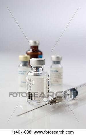 Stock Photo - Syringe and three phials. Fotosearch