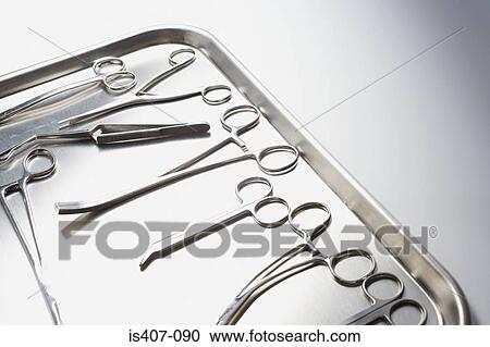 Stock Image - Tray of surgical scissors. Fotosearch