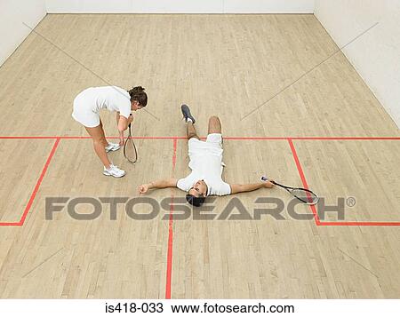 Exhausted squash players View Large Photo Image Stock Image - Exhausted squash players. Fotosearch