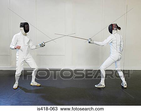 Fencers crossing foils View Large Photo Image Stock Image - Fencers crossing foils. Fotosearch