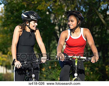Friends cycling View Large Photo Image Stock Photograph - Friends cycling. Fotosearch