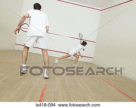 Picture - Man and woman playing squash. Fotosearch