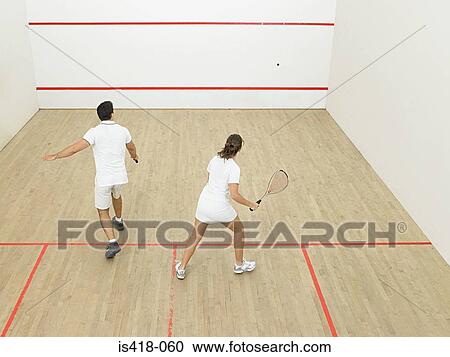 Man and woman playing squash View Large Photo Image Stock Image - Man and woman playing squash. Fotosearch