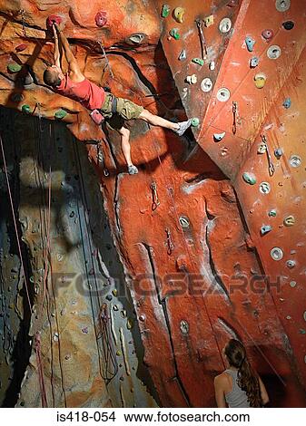 Picture - Man on climbing wall. Fotosearch