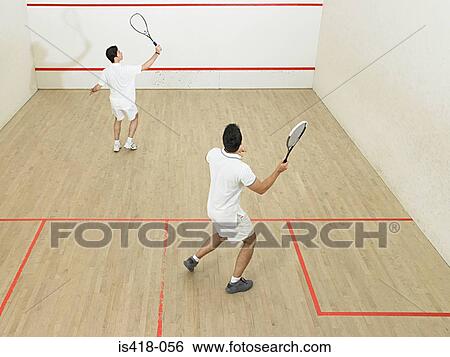 Stock Photograph - Men playing squash. Fotosearch