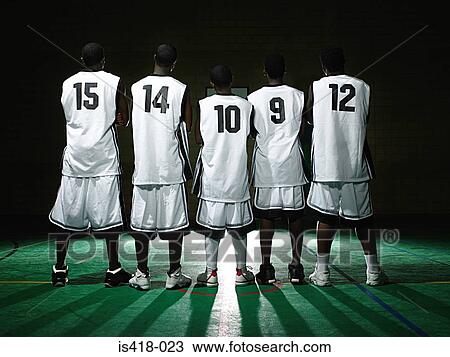 Stock Image - Rear view of basketball team. Fotosearch