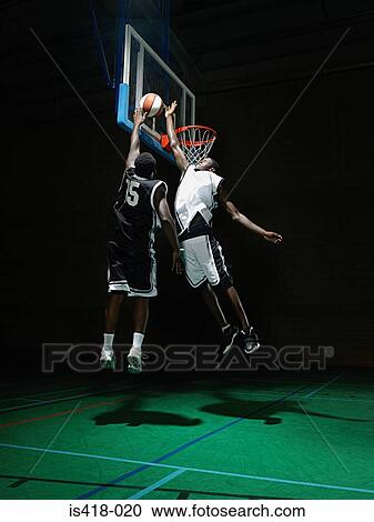 Rival basketball players View Large Photo Image Stock Image - Rival basketball players. Fotosearch