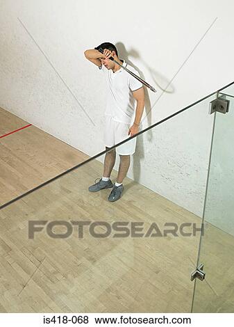 Tired squash player View Large Photo Image Stock Photo - Tired squash player. Fotosearch