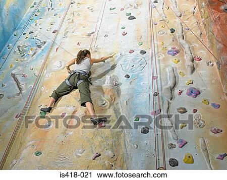 Woman on climbing wall View Large Photo Image Stock Image - Woman on climbing wall. Fotosearch