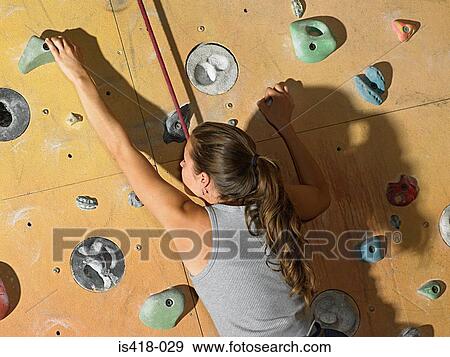 Woman on climbing wall View Large Photo Image Stock Photo - Woman on climbing wall. Fotosearch