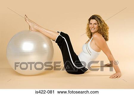 Woman with exercise ball View Large Photo Image Stock Image - Woman with exercise ball. Fotosearch