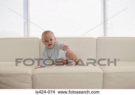 Baby sat on sofa View Large Photo Image Picture - Baby sat on sofa. Fotosearch