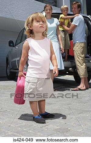 Family packing car to go on holiday View Large Photo Image Stock Photo - Family packing car to go on holiday. Fotosearch