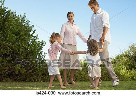 Family playing in the garden View Large Photo Image Stock Image - Family playing in the garden. Fotosearch