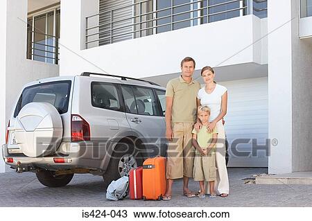Family stood by car with suitcases View Large Photo Image Stock Image - Family stood by car with suitcases. Fotosearch