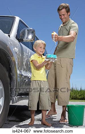 Father and son washing family car View Large Photo Image Stock Photo - Father and son washing family car. Fotosearch