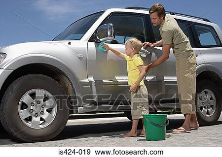 Father and son washing the car View Large Photo Image Stock Photo - Father and son washing the car. Fotosearch