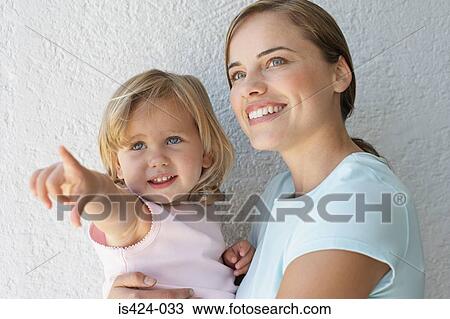 Mother holding her daughter View Large Photo Image Stock Image - Mother holding her daughter. Fotosearch
