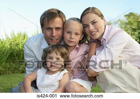 Portrait of a family in the garden View Large Photo Image Stock Image - Portrait of a family in the garden. Fotosearch