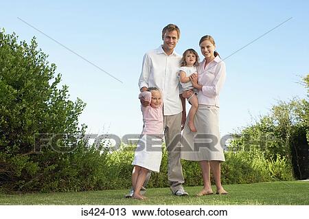 Portrait of a family in the garden View Large Photo Image Stock Image - Portrait of a family in the garden. Fotosearch
