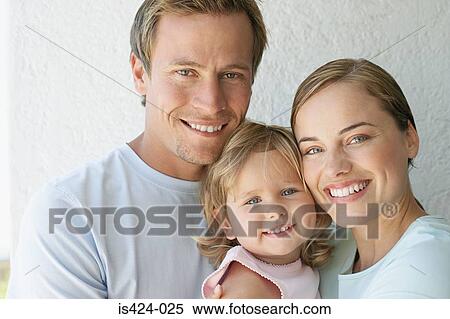Stock Photography - Portrait of mother father and young daughter. Fotosearch