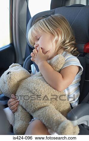 Young girl sleeping in a car View Large Photo Image Stock Photograph - Young girl sleeping in a car. Fotosearch