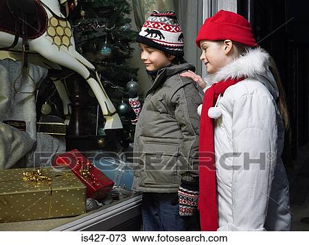 Brother and sister christmas shopping View Large Photo Image Stock Image - Brother and sister christmas shopping. Fotosearch