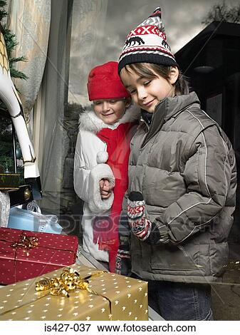 Brother and sister christmas shopping View Large Photo Image Stock Photo - Brother and sister christmas shopping. Fotosearch