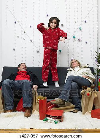 Stock Photo - Couple exhausted after christmas shopping. Fotosearch