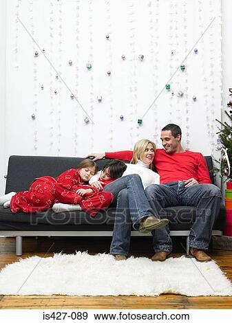 Family at christmas time View Large Photo Image Stock Photo - Family at christmas time. Fotosearch