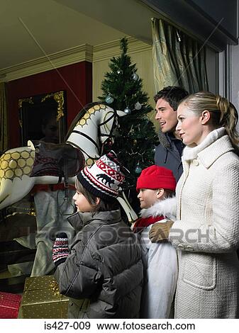 Family out christmas shopping View Large Photo Image Stock Photo - Family out christmas shopping. Fotosearch