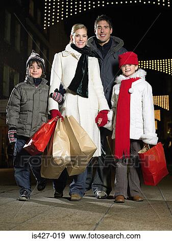 Stock Photo - Family out christmas shopping. Fotosearch