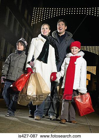 Family out christmas shopping View Large Photo Image Stock Photo - Family out christmas shopping. Fotosearch