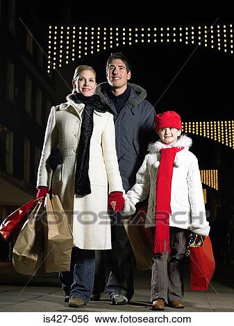Family out christmas shopping View Large Photo Image Stock Photograph - Family out christmas shopping. Fotosearch