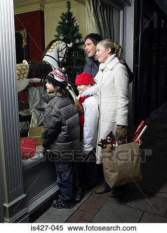 Family out christmas shopping View Large Photo Image Stock Photography - Family out christmas shopping. Fotosearch