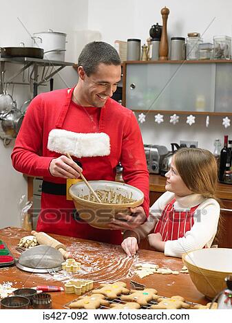 Father and daughter making cookies View Large Photo Image Stock Image - Father and daughter making cookies. Fotosearch
