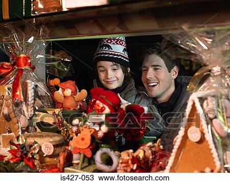 Father and son christmas shopping View Large Photo Image Stock Image - Father and son christmas shopping. Fotosearch